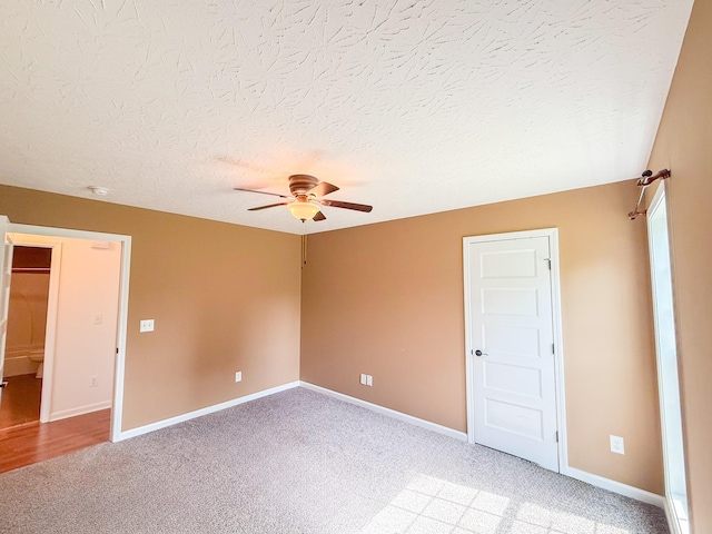 41 Haven Way, Westmoreland, TN 37186 - unfurnished bedroom featuring light carpet, baseboards, a textured ceiling, and ceiling fan