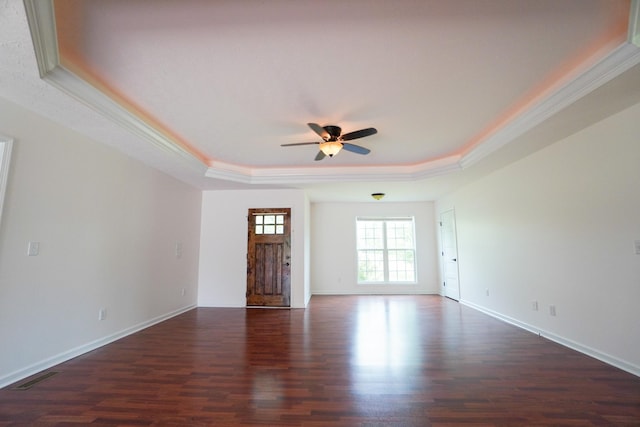 41 Haven Way, Westmoreland, TN 37186 - unfurnished living room featuring a tray ceiling, dark wood-type flooring, ceiling fan, ornamental molding, and baseboards