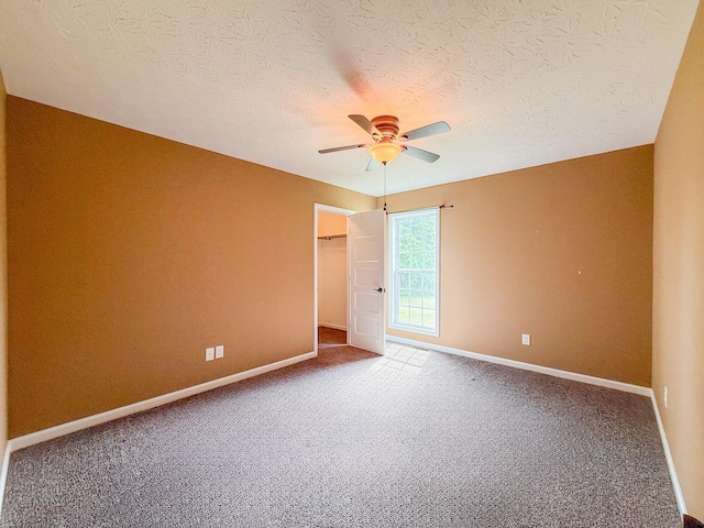 41 Haven Way, Westmoreland, TN 37186 - unfurnished room with ceiling fan, carpet, baseboards, and a textured ceiling