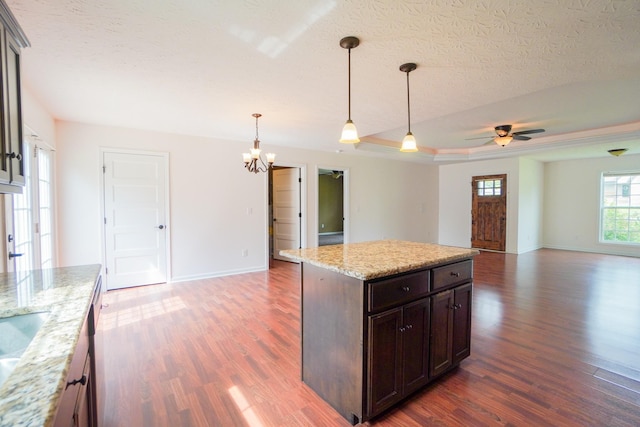 41 Haven Way, Westmoreland, TN 37186 - kitchen with dark wood-style flooring, open floor plan, a chandelier, a ceiling fan, and baseboards