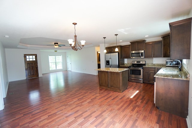 41 Haven Way, Westmoreland, TN 37186 - kitchen featuring stainless steel appliances, a sink, open floor plan, a center island, and dark wood-style flooring