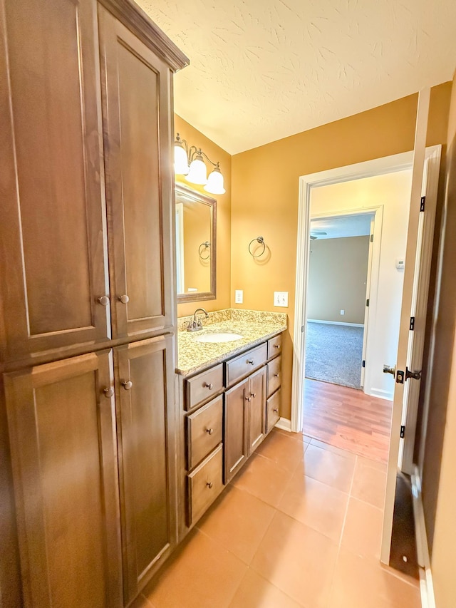 41 Haven Way, Westmoreland, TN 37186 - bathroom with tile patterned floors, a textured ceiling, vanity, and baseboards