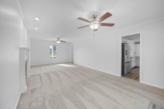 2746 Field Ct, Woodlawn, TN 37191 - unfurnished living room with light carpet, ornamental molding, a ceiling fan, baseboards, and a fireplace with flush hearth