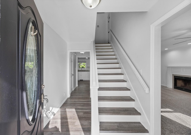 2746 Field Ct, Woodlawn, TN 37191 - stairway with a fireplace and wood finished floors