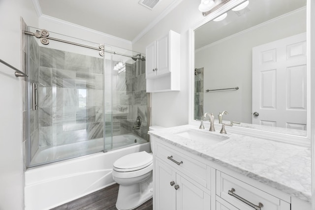 2746 Field Ct, Woodlawn, TN 37191 - full bathroom with vanity, enclosed tub / shower combo, ornamental molding, toilet, and wood finished floors