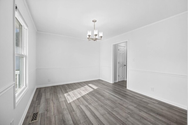 2746 Field Ct, Woodlawn, TN 37191 - empty room with a chandelier, wood finished floors, baseboards, and ornamental molding