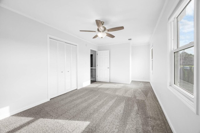2746 Field Ct, Woodlawn, TN 37191 - unfurnished bedroom featuring ornamental molding, carpet, a closet, baseboards, and ceiling fan