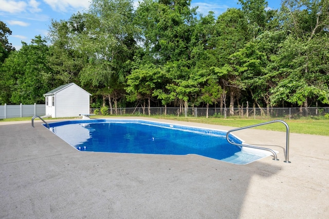 2746 Field Ct, Woodlawn, TN 37191 - view of pool featuring a patio, an outdoor structure, and view of wooded area
