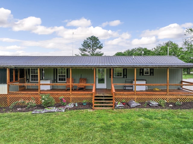 4496 Jonesville Rd, Clarkrange, TN 38553 - view of front facade with a porch, metal roof, and a front yard