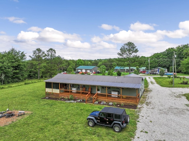 4496 Jonesville Rd, Clarkrange, TN 38553 - view of front of home with covered porch, a front lawn, and metal roof