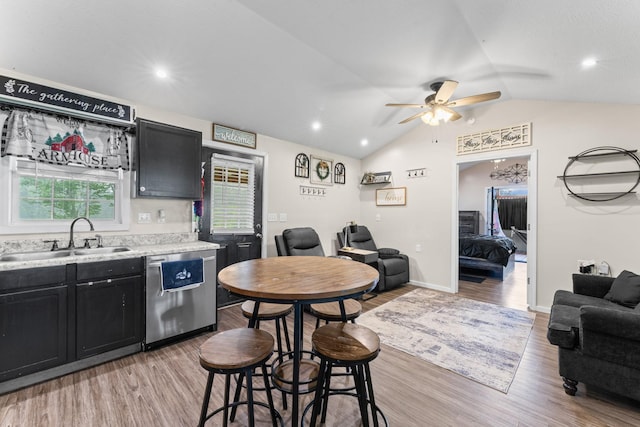 4496 Jonesville Rd, Clarkrange, TN 38553 - kitchen featuring dishwasher, a sink, dark cabinets, vaulted ceiling, and light wood-type flooring
