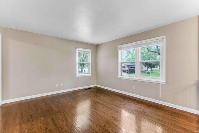 600 Holiday Park Dr, Hopkinsville, KY 42240 - unfurnished room featuring baseboards and dark wood-type flooring