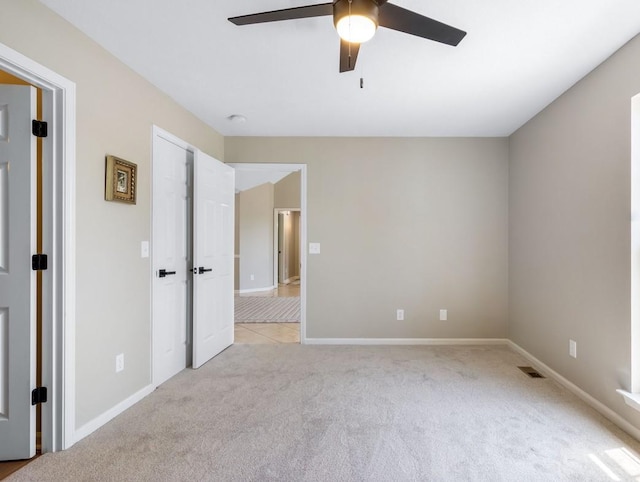 2549 Hillingdon Dr, Murfreesboro, TN 37127 - unfurnished bedroom featuring light colored carpet, baseboards, and a ceiling fan