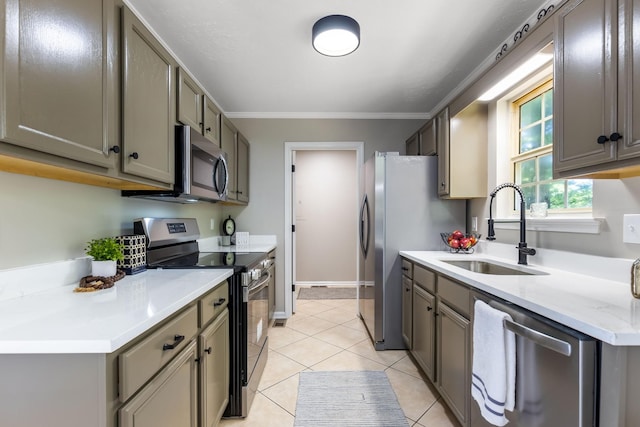2549 Hillingdon Dr, Murfreesboro, TN 37127 - kitchen with appliances with stainless steel finishes, a sink, crown molding, gray cabinets, and light tile patterned floors