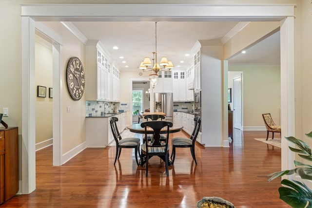 2111 Lovelace Ln, Murfreesboro, TN 37130 - dining room with crown molding, a chandelier, baseboards, recessed lighting, and dark wood finished floors