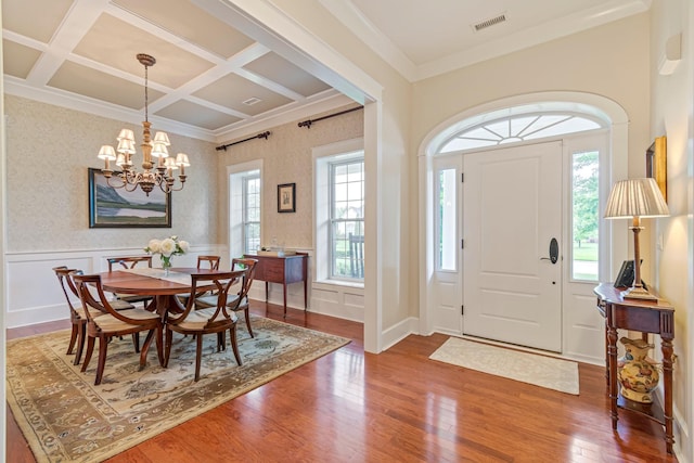 2111 Lovelace Ln, Murfreesboro, TN 37130 - foyer entrance featuring a chandelier, wood finished floors, coffered ceiling, wainscoting, and crown molding