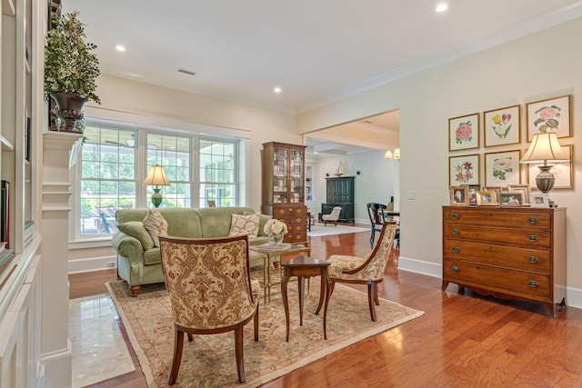 2111 Lovelace Ln, Murfreesboro, TN 37130 - living area featuring healthy amount of natural light, wood finished floors, crown molding, recessed lighting, and baseboards