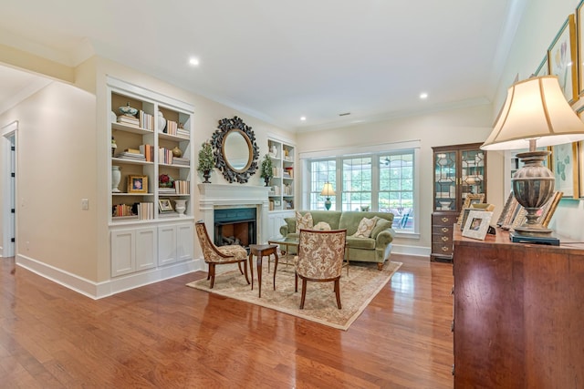 2111 Lovelace Ln, Murfreesboro, TN 37130 - living area with wood finished floors, crown molding, a fireplace, baseboards, and recessed lighting