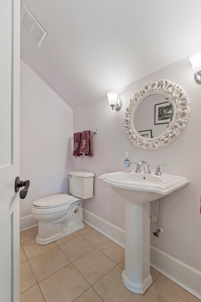 2111 Lovelace Ln, Murfreesboro, TN 37130 - bathroom with baseboards, tile patterned flooring, toilet, and vaulted ceiling