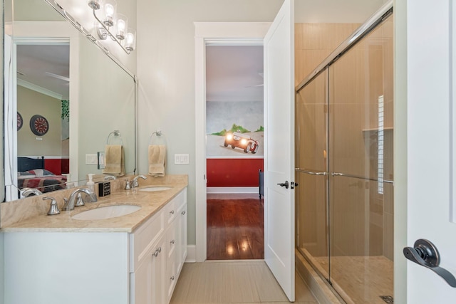 2111 Lovelace Ln, Murfreesboro, TN 37130 - ensuite bathroom with double vanity, an enclosed shower, ornamental molding, and baseboards