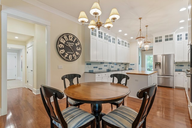 2111 Lovelace Ln, Murfreesboro, TN 37130 - dining space featuring a chandelier, light wood finished floors, recessed lighting, and baseboards