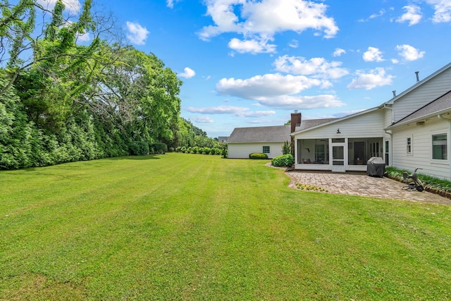 2111 Lovelace Ln, Murfreesboro, TN 37130 - view of green lawn featuring a sunroom and a patio area