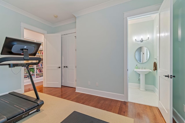 2111 Lovelace Ln, Murfreesboro, TN 37130 - exercise room featuring wood finished floors, crown molding, and baseboards