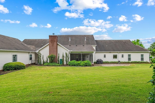 2111 Lovelace Ln, Murfreesboro, TN 37130 - rear view of house with a lawn and a sunroom