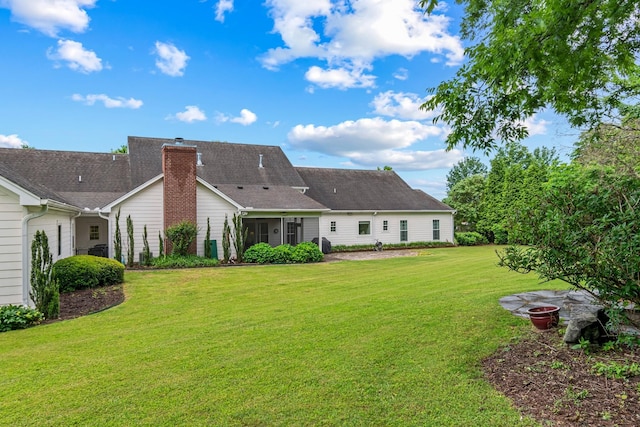 2111 Lovelace Ln, Murfreesboro, TN 37130 - back of house with a lawn and a chimney