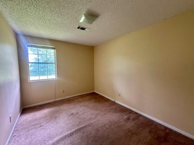 2045 Nonaville Rd, Mount Juliet, TN 37122 - unfurnished room with carpet floors, a textured ceiling, and baseboards