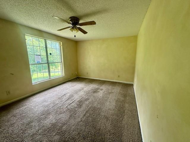 2045 Nonaville Rd, Mount Juliet, TN 37122 - empty room with a ceiling fan, a textured ceiling, carpet floors, and baseboards