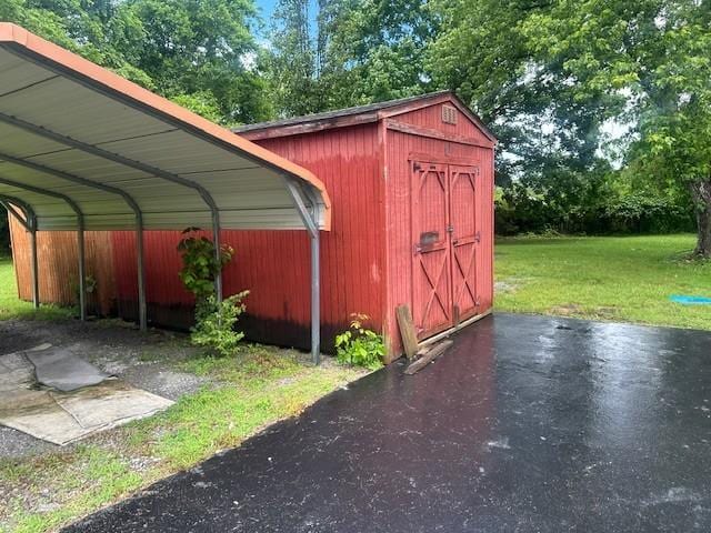 2045 Nonaville Rd, Mount Juliet, TN 37122 - view of outdoor structure featuring view of wooded area and a carport