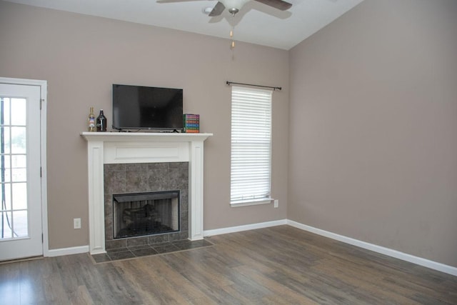 112 Read Tavern Rd, Hendersonville, TN 37075 - unfurnished living room featuring ceiling fan, wood finished floors, a tiled fireplace, baseboards, and vaulted ceiling