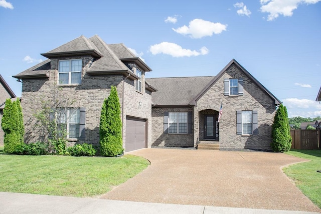 112 Read Tavern Rd, Hendersonville, TN 37075 - view of front of house with driveway, brick siding, and roof with shingles