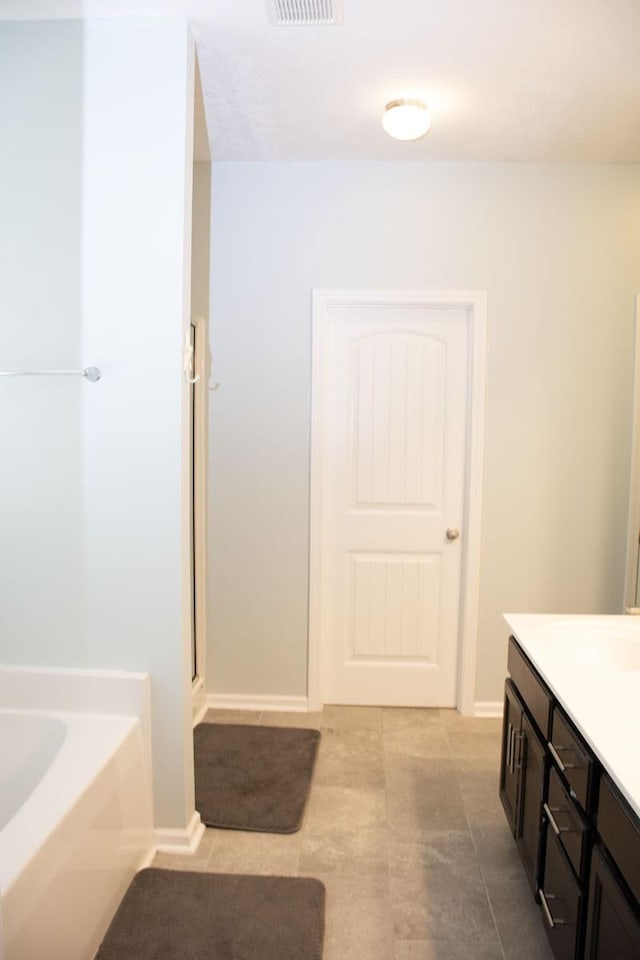 112 Read Tavern Rd, Hendersonville, TN 37075 - full bath featuring a garden tub, vanity, a stall shower, and tile patterned flooring