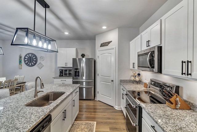 211 Addison Ave, Chapel Hill, TN 37034 - kitchen with stainless steel appliances, a sink, recessed lighting, white cabinets, and light stone counters