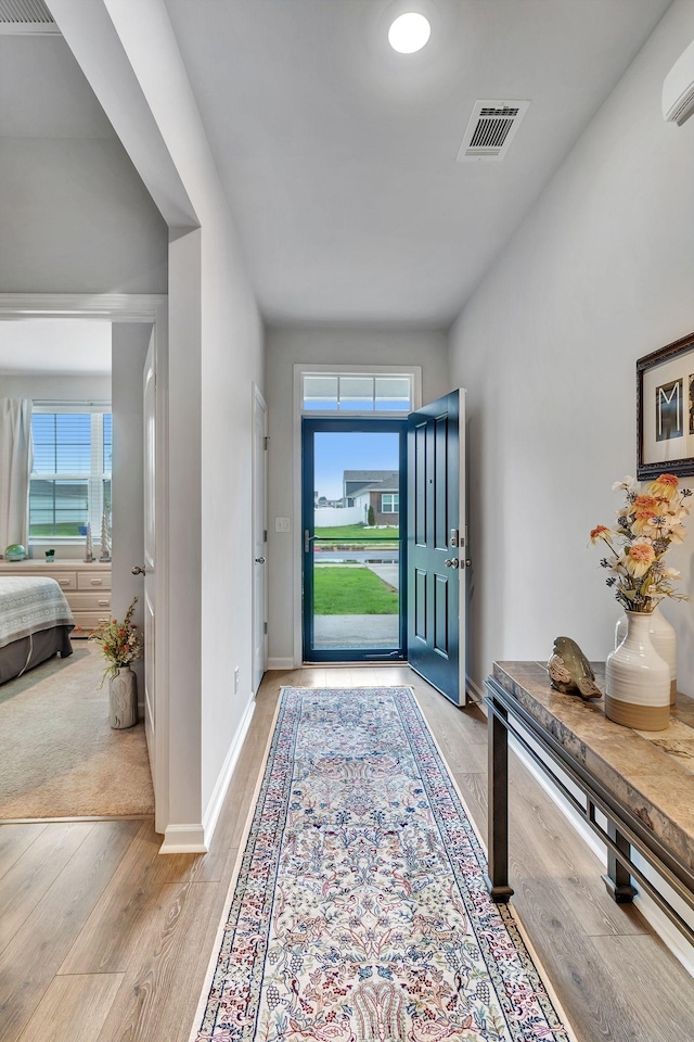 211 Addison Ave, Chapel Hill, TN 37034 - entrance foyer with light wood-style flooring, baseboards, and a wall mounted AC