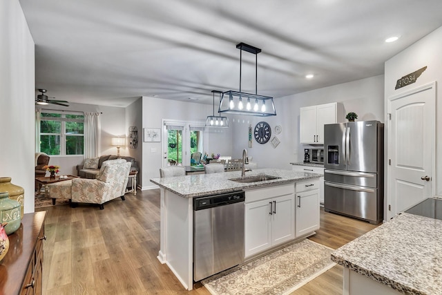 211 Addison Ave, Chapel Hill, TN 37034 - kitchen featuring appliances with stainless steel finishes, a sink, white cabinetry, open floor plan, and recessed lighting