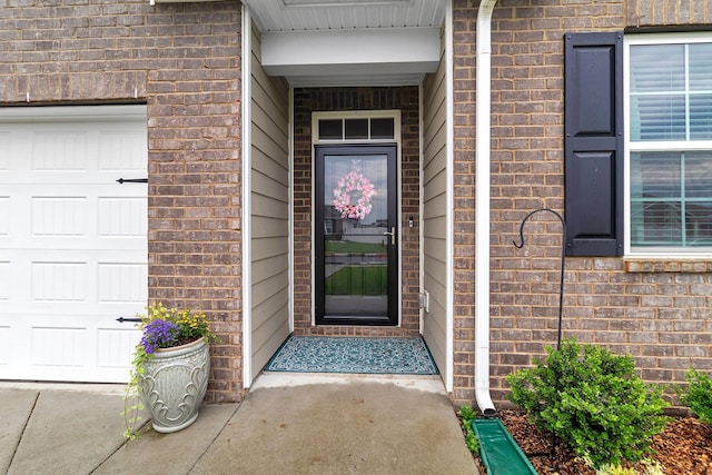 211 Addison Ave, Chapel Hill, TN 37034 - view of exterior entry with brick siding and a garage