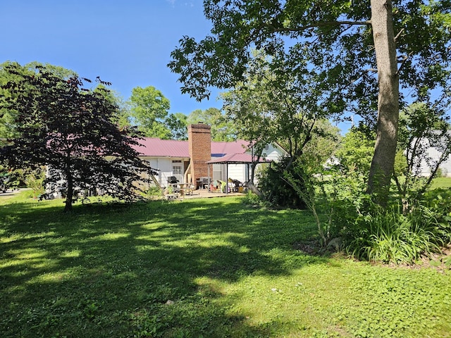 221 Franklin St, Cowan, TN 37318 - view of grassy yard with a patio area