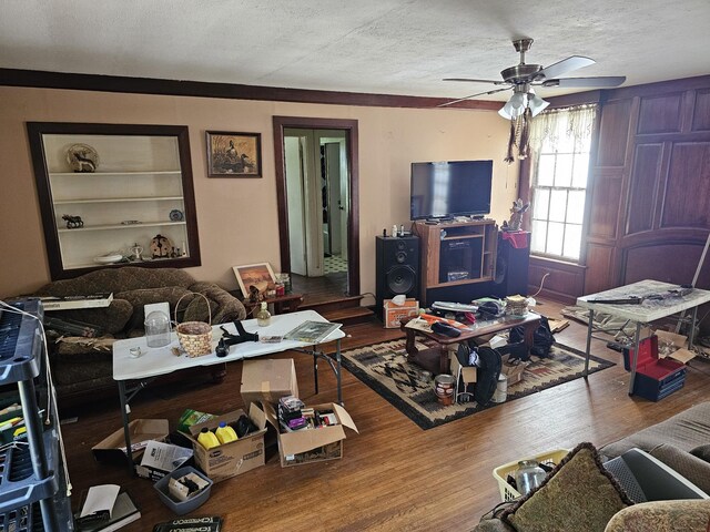 221 Franklin St, Cowan, TN 37318 - living area featuring wood finished floors, a textured ceiling, and a ceiling fan