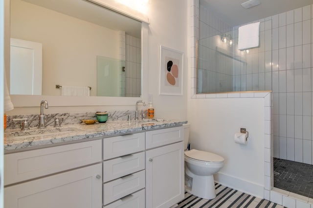 2001 Convent Pl Unit 7, Nashville, TN 37212 - full bathroom featuring toilet, a walk in shower, double vanity, and tile patterned flooring