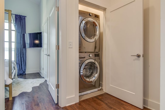 2001 Convent Pl Unit 7, Nashville, TN 37212 - laundry area with stacked washer and clothes dryer, dark wood-type flooring, and baseboards