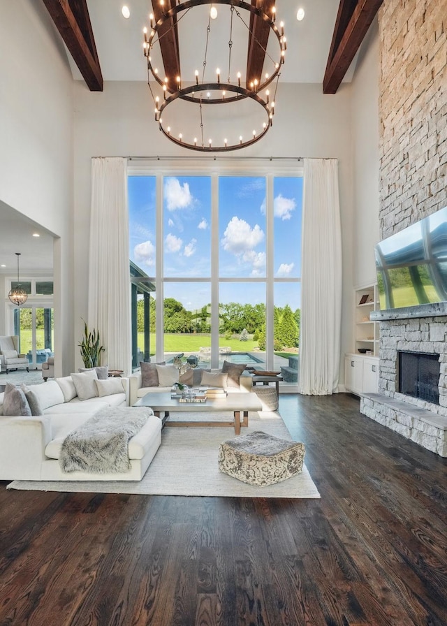 4740 Edwardian Trce, Franklin, TN 37067 - living area with a high ceiling, beam ceiling, a chandelier, a fireplace, and wood finished floors