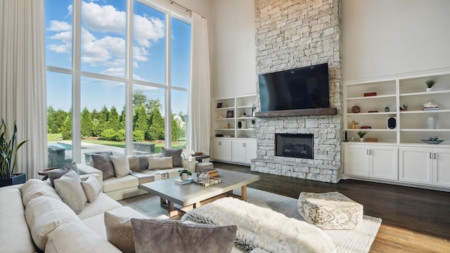4740 Edwardian Trce, Franklin, TN 37067 - living room with a stone fireplace, dark wood finished floors, and a high ceiling