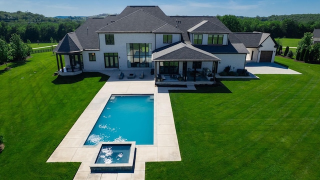 4740 Edwardian Trce, Franklin, TN 37067 - back of house with a shingled roof, a patio, and a pool with connected hot tub