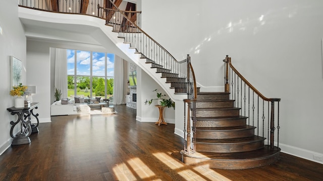 4740 Edwardian Trce, Franklin, TN 37067 - stairs featuring a towering ceiling, baseboards, and wood finished floors
