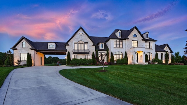 4740 Edwardian Trce, Franklin, TN 37067 - french country inspired facade with curved driveway, a front yard, stone siding, and brick siding