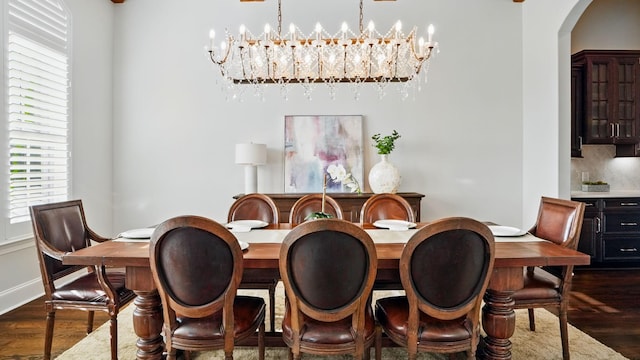 4740 Edwardian Trce, Franklin, TN 37067 - dining room with dark wood-type flooring, arched walkways, and a chandelier