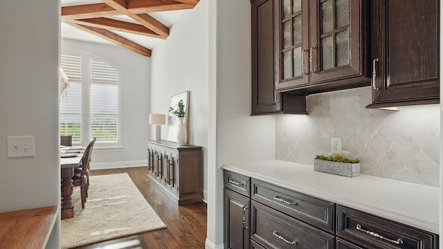 4740 Edwardian Trce, Franklin, TN 37067 - kitchen with beamed ceiling, dark brown cabinetry, dark wood finished floors, light countertops, and backsplash